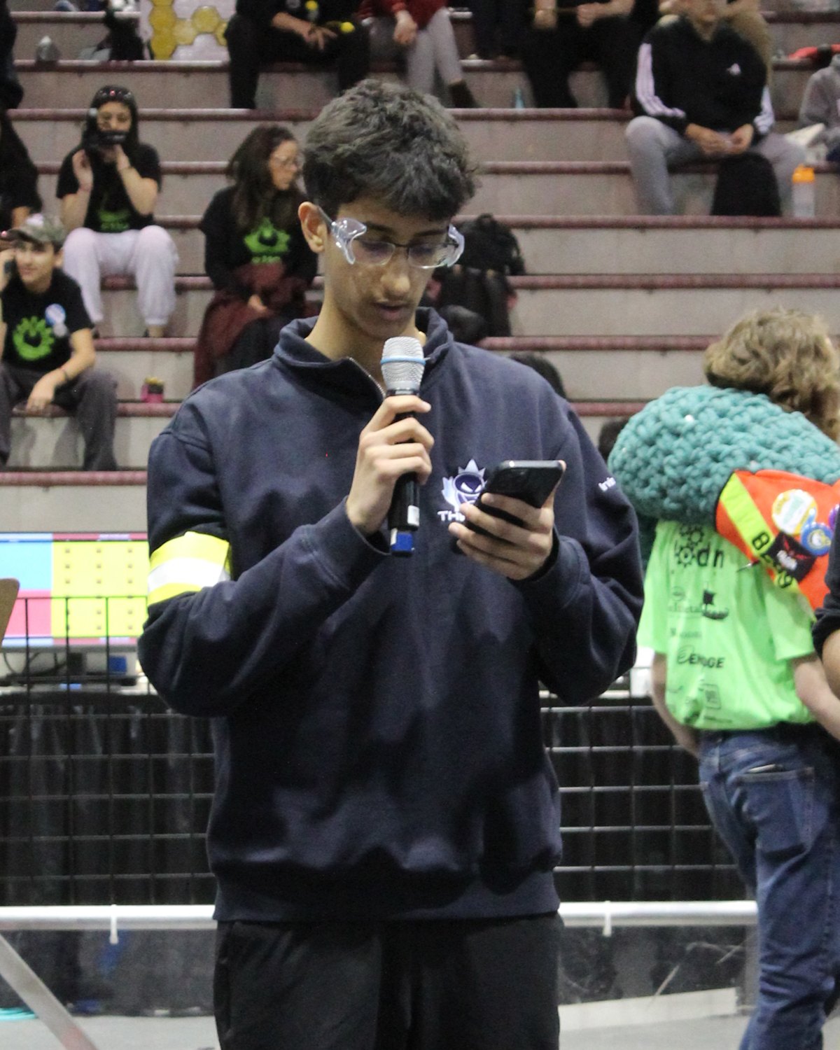 Irvin Sivya on the microphone at an FRC event with Team 1241